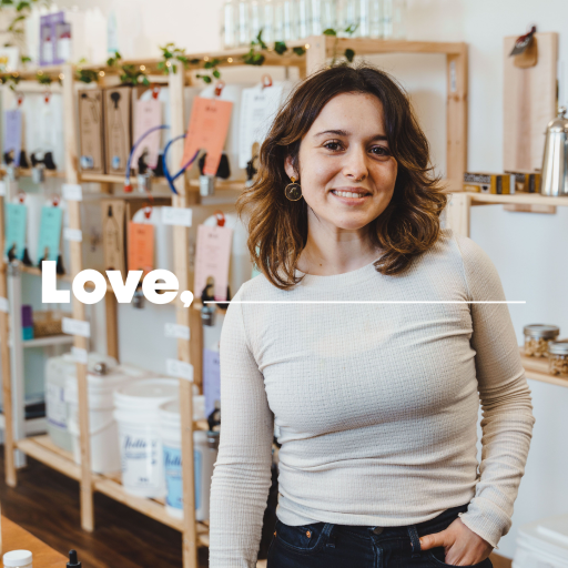 Woman in white shirt standing in a shop